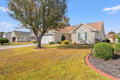 Single story home featuring a garage and a front l