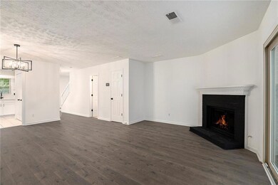 Unfurnished living room featuring a notable chande