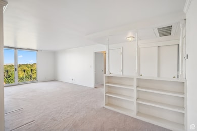 Unfurnished room with light carpet and ornamental molding