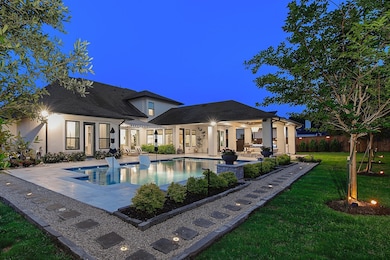 Backyard oasis with sparkling pool and oversized jacuzzi. Perfect for year round enjoyment.