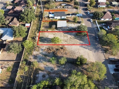 Aerial view of residential area featuring property parcel outlined