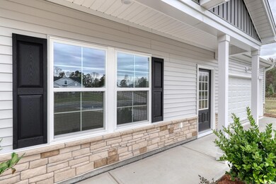 View of exterior entry with a garage