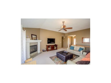 Large open living room has direct vent gas firepla