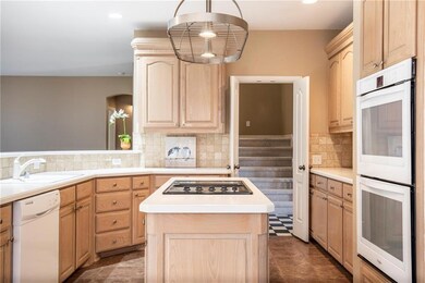 Light and bright open kitchen with double ovens, t