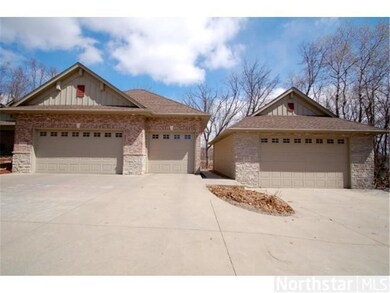 Nice! An expansive concrete driveway leads to the 