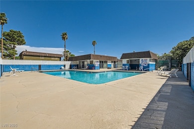 Enclosed community pool and spa w/ deck.