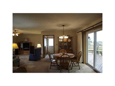 . Dining area with sliders leading to large deck. 