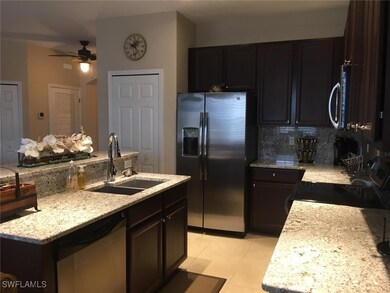 Kitchen featuring tasteful backsplash, appliances