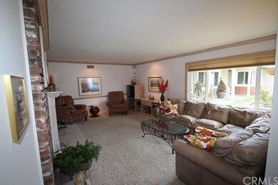 Living room with brick fireplace