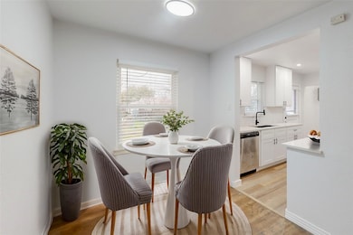Dining room with sink and light hardwood / wood-st