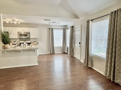 This bright, open dining area is the perfect spot to enjoy a morning cup of coffee or dinner with family and friends.