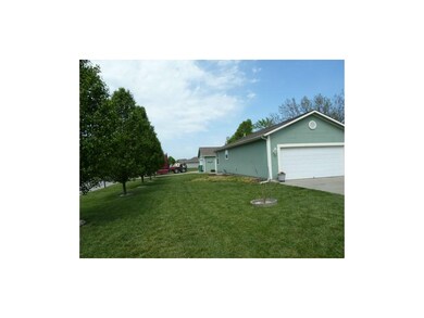 Side yard with row of flowering bradford pear tres