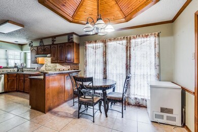 Kitchen featuring refrigerator, decorative light f