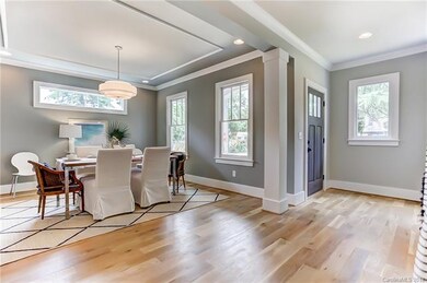 Front door opens to foyer and well lit windowed di