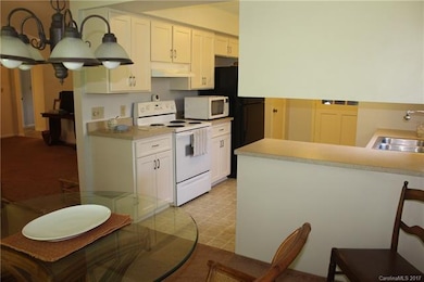 Another view of the Kitchen.  Door to the right of