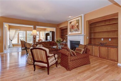 Great room with gas fireplace flanked by built-in 