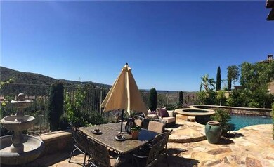 Flagstone patios, views forever, and blue water in
