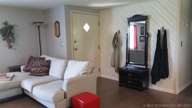 Second view of the living room shows the front doo