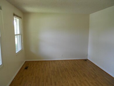 Large family room with hardwood floors