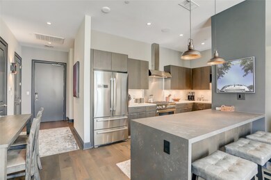 From this angle, you can see the foyer, kitchen, a