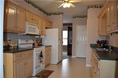 Kitchen has Plenty of Counter Space and Pantry