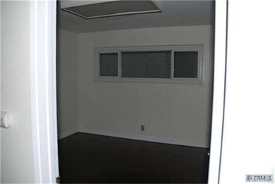 downstairs bedroom with wood floor