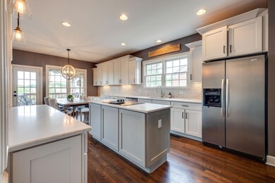 Plenty of counter space and cabinet storage in this kitchen. The pantry is located to the right of the refrigerator. 