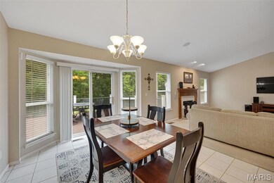 Breakfast area with sliding doors to composite deck and wooded views!