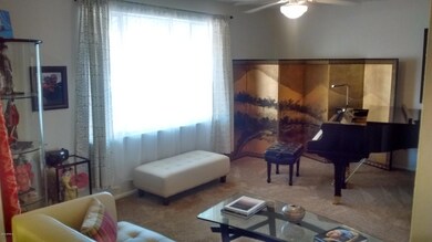 Living room fits a grand piano and more!