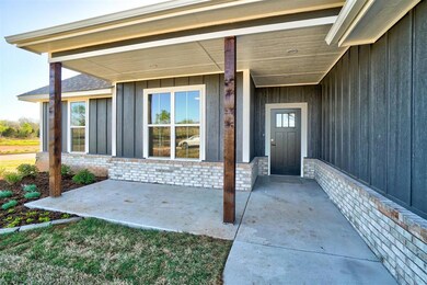 Doorway to property with a patio area