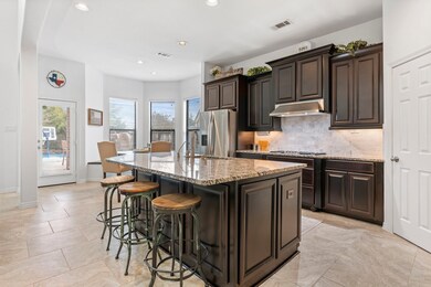 Sun filled kitchen and breakfast area.  Large sink