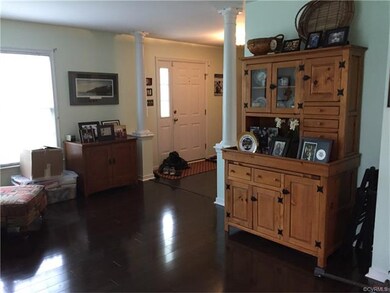 Formal living room with wood laminate flooring.