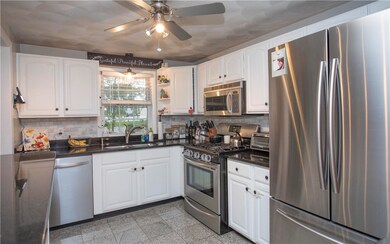 Kitchen with granite counters and stainless steel
