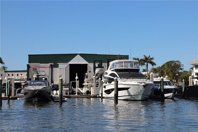 Slip 28 with large white yacht