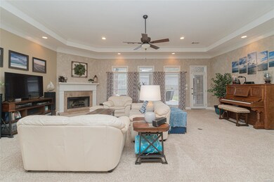 Formal living room with corner fireplace