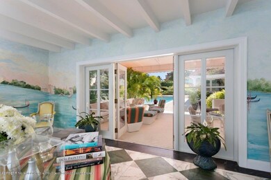 Venetian foyer opens to patio