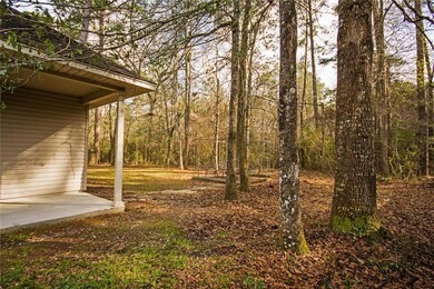 Spacious yard backed up to the woods.