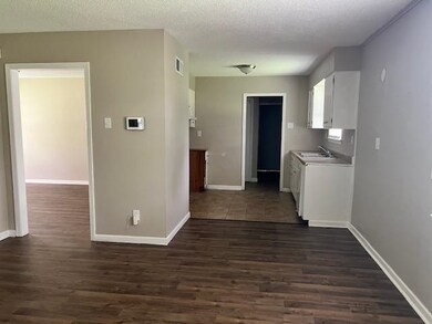 Kitchen with dark hardwood / wood-style floors, wh