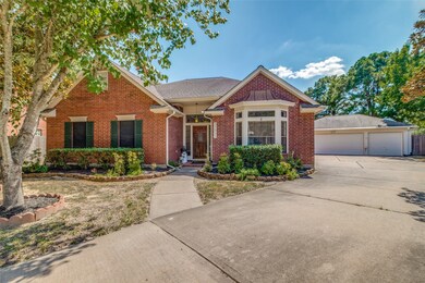Long driveway leads to the detached, 3-car garage.