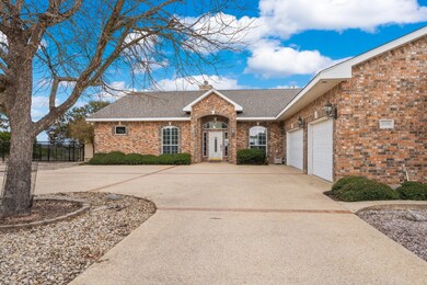 View of front of property featuring concrete driv