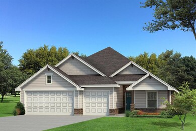 View of front facade featuring a front yard, brick