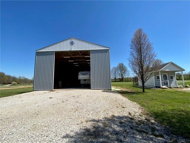 40 x 40 barn w 20 ft doors, solar panels, and reinforced concrete