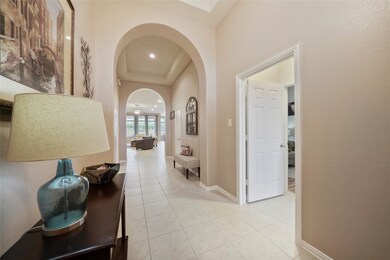 This light filled home has 11' ceilings throughout! The door on the right leads to a private wing with two large bedrooms and a bathroom.