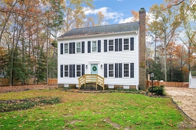 Colonial-style house with a front lawn