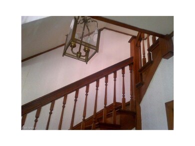 Wow  staircase wraps around to the second floor be