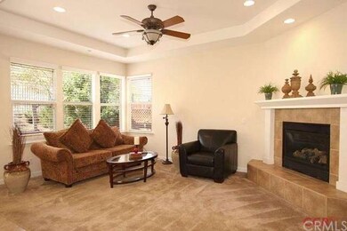Family room adjoins the kitchen and lets in the vi