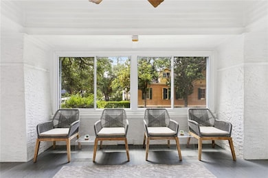 Enclosed sun porch overlooking Fern St.
