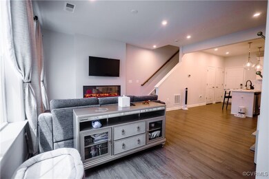 Living room featuring sink and dark hardwood / woo