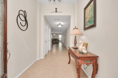 Welcoming foyer accented by a solid Mahogany Leaded Glass front door.