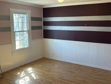 Unfurnished room featuring wood finished floors, 